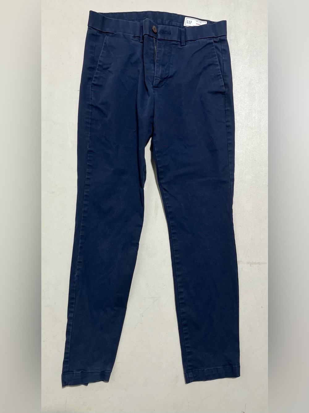GAP Navy Skinny Jeans with White Label and Red Accent